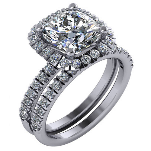 Halo style engagement ring with cushion cut center diamond and round cut side diamonds, paired with matching wedding band