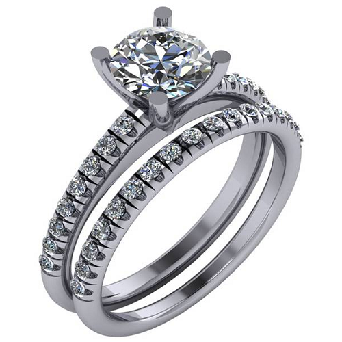 Engagement ring with round cut center diamond and round cut side diamonds, paired with matching wedding band