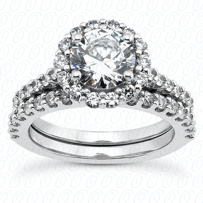 Halo style engagement ring with round cut center diamond and round cut side diamonds, paired with matching wedding band