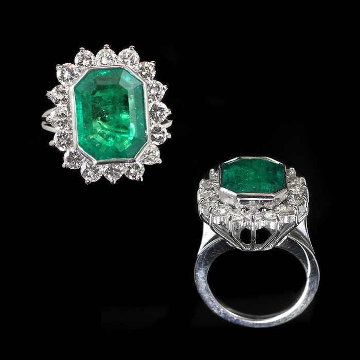 Emerald cut emerald ring with round cut diamonds