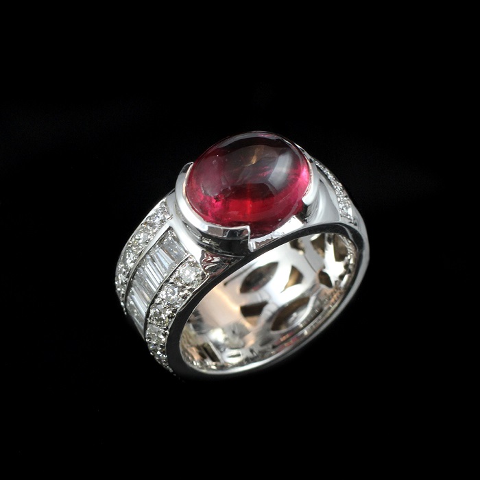 Cabochon shape rubelite ring with round and baguette cut diamonds