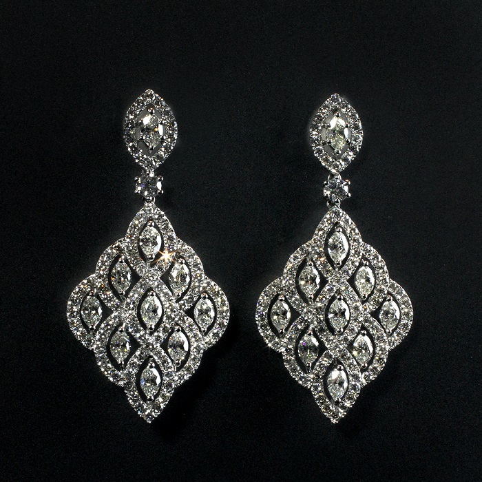 Vintage style dangle earrings with round and marquise cut diamonds