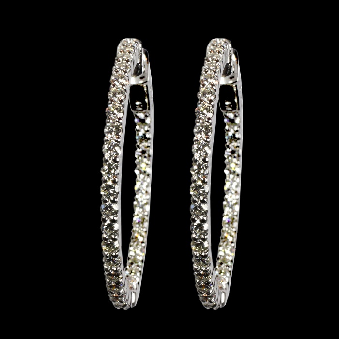 Inside-out hoop earrings in white gold with round cut diamonds