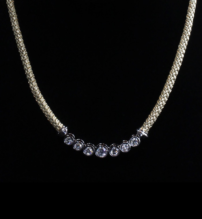 Mesh chain with bezel set round cut diamonds